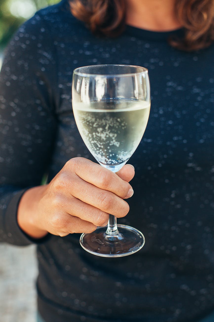 woman holding wine glass